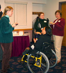 Members chat before the presentation.