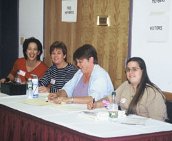 Volunteers cheerfully welcome members.